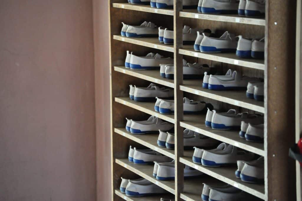 white and blue shoes in rack inside room